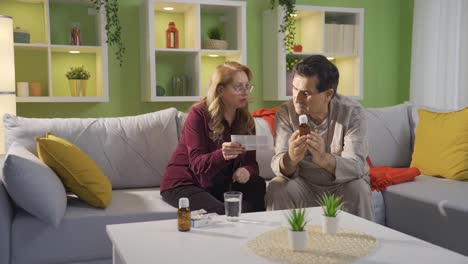 The-couple-who-is-knowledgeable-about-health-at-home.-A-female-patient-is-reading-the-medicine-leaflet-to-her-husband.